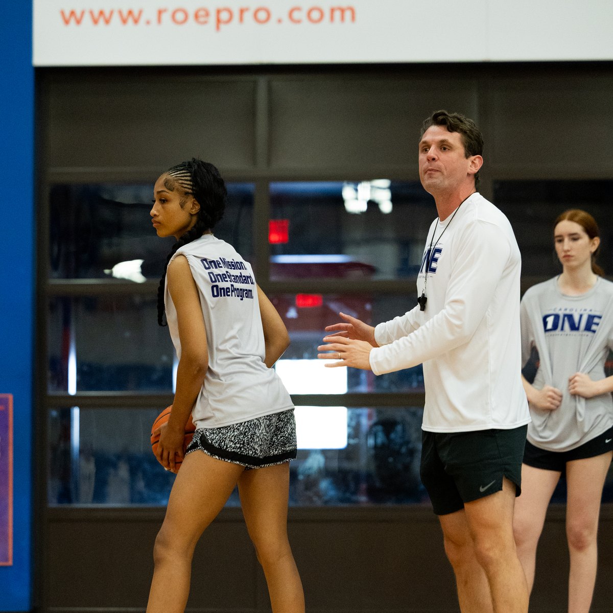 Coach walking through a live rep